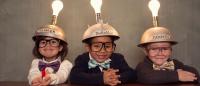 This young group of students are glowing in knowledge; children Wearing Lighted Mind Reading Helmets.